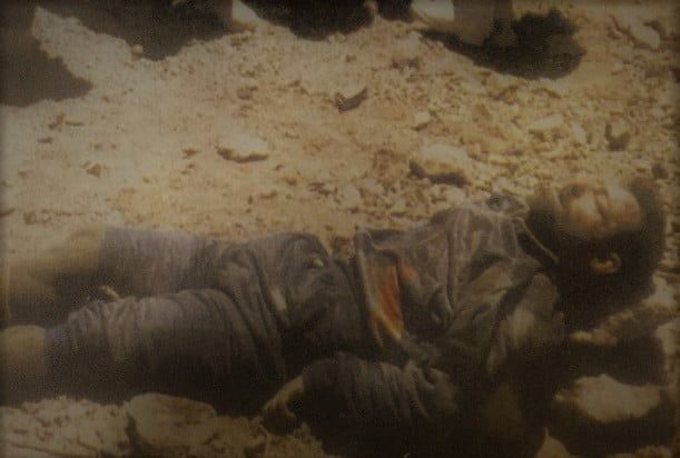Karnal Sher Khan was martyred due the machine gun bullets, and was lay down on his knees.