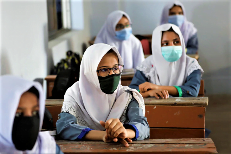 Students keep safe distance while attending a class as schools reopen amid the coronavirus disease (COVID-19) pandemic, in Karachi
