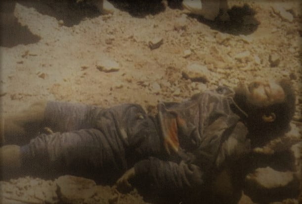 Karnal Sher Khan was martyred due the machine gun bullets, and was lay down on his knees.