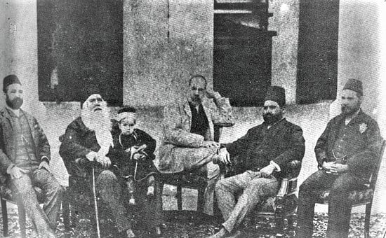 Sir Syed enjoys an evening at his home with a group of Muslim intellectuals. The child on his lap is his grandson