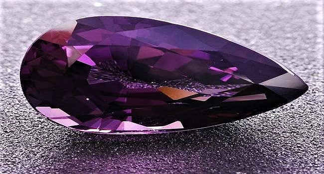 taaffeite is a mauve-hued gem made of magnesium and other elements